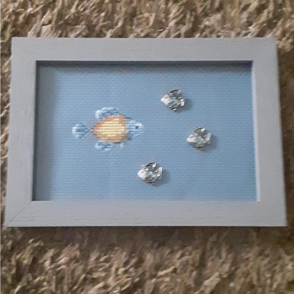Cross Stitch Fish Picture Accents Fish On Glass A Blue Hue Wood Frame.